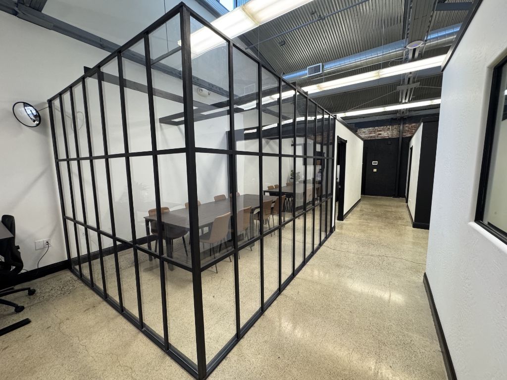 Valley Roots Realty office — glass-walled conference room